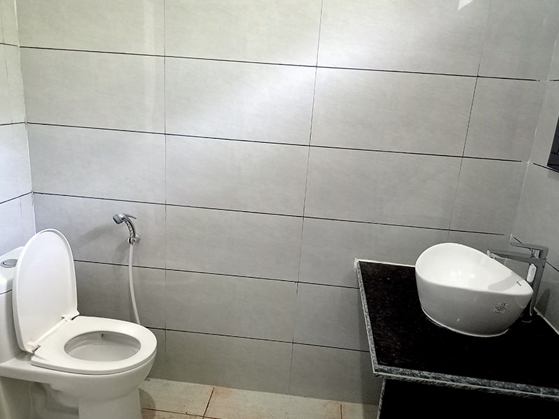 Spacious washroom with hot running water.